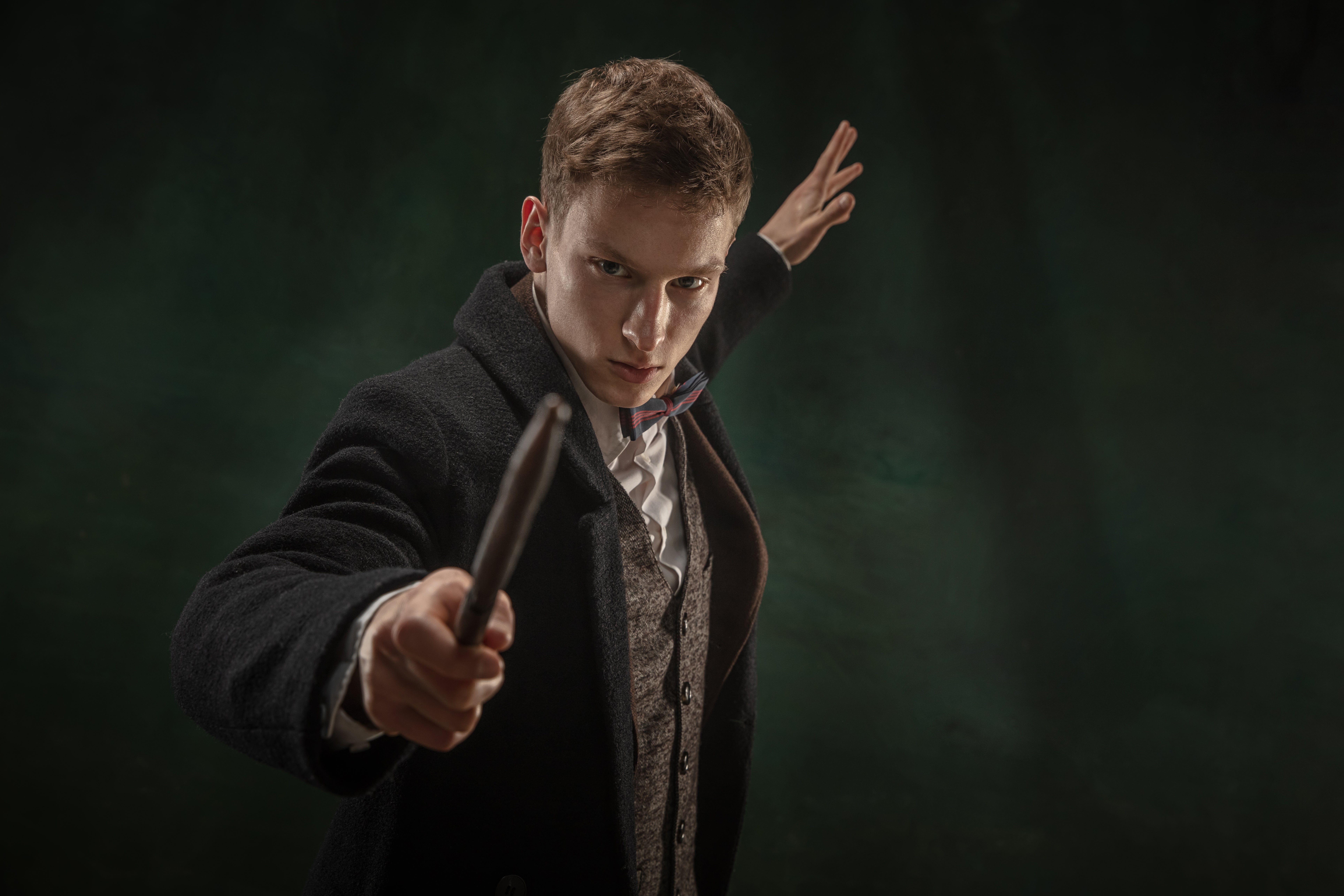intense-young-man-holding-a-dark-wooden-stick-2026-09-24-19-08-13-utc.jpg